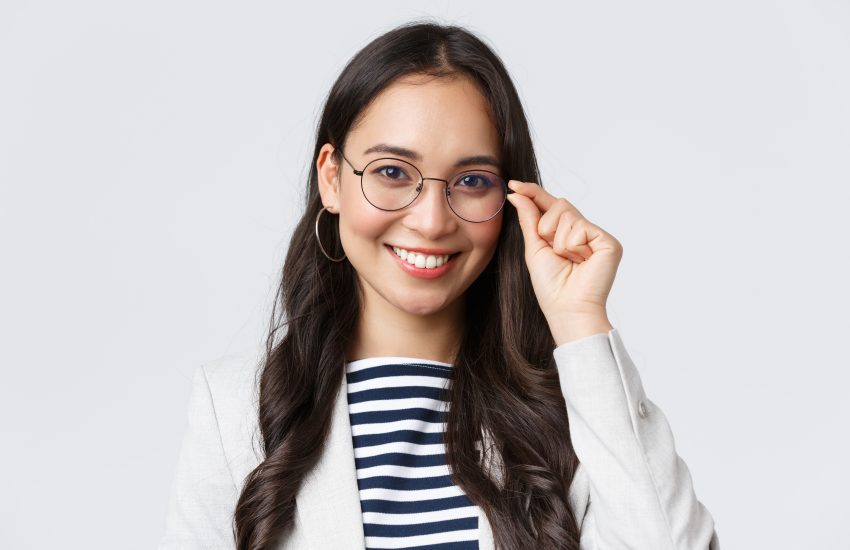 Business, finance and employment, female successful entrepreneurs concept. Talented young asian female IT programmer in glasses, customer support manager smiling at camera